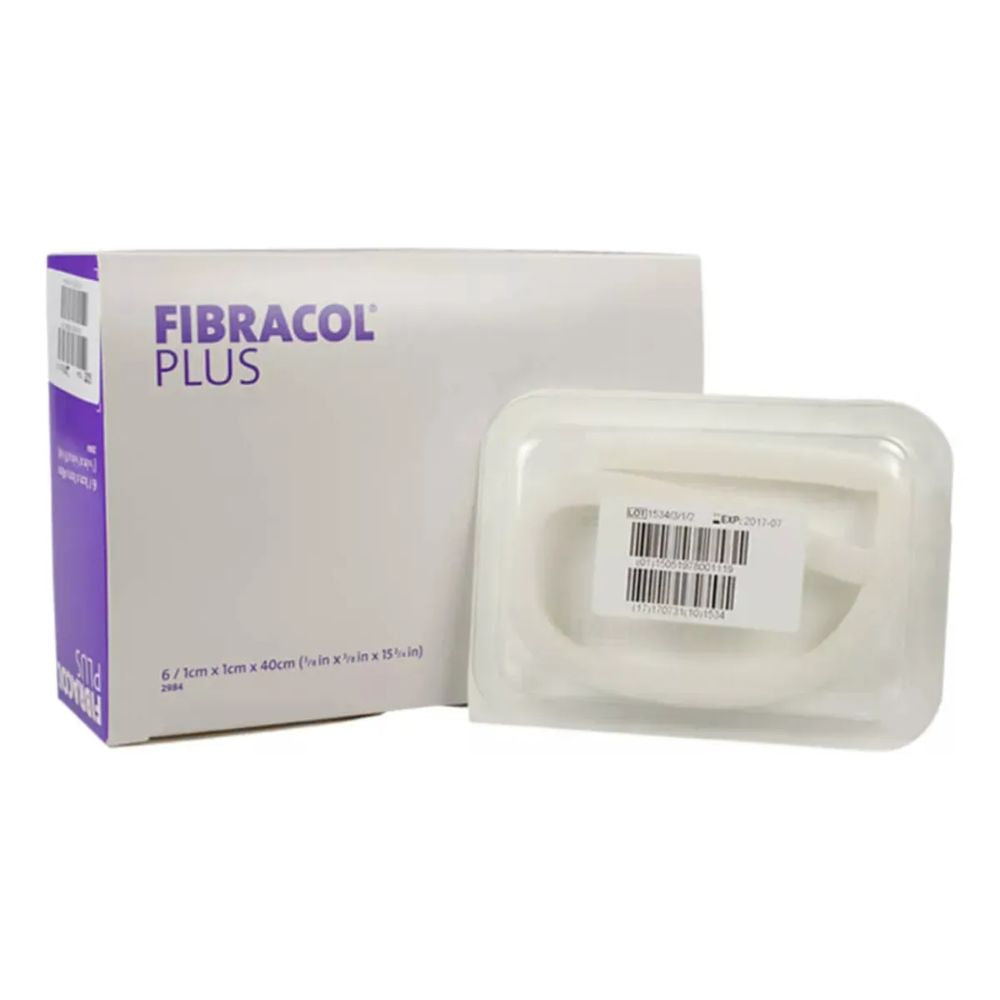 Apósito Fibracol Plus con alginato en bandeja, junto a caja