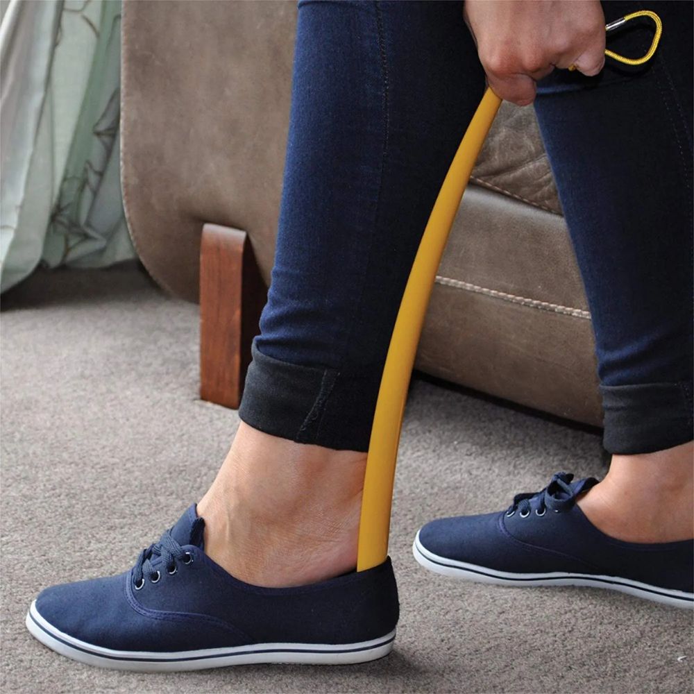 Calzador de zapato amarillo de plástico, con mango largo