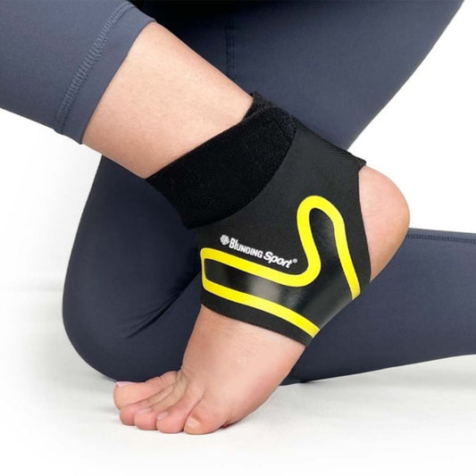 Soporte de tobillo deportivo negro con refuerzo y banda elástica amarilla